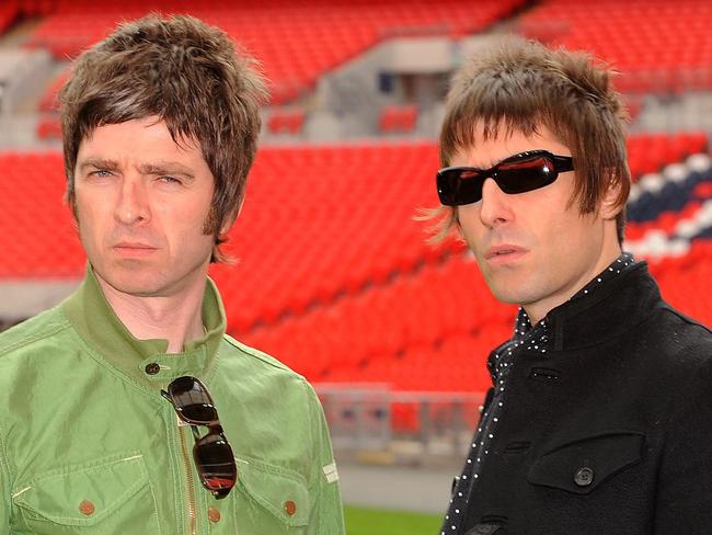 LONDON, ENGLAND - OCTOBER 16:  Noel Gallagher (left) and Liam Gallagher of Oasis pose at Wembley Stadium on October 16, 2008 in London, England. (Photo by Samir Hussein/Getty Images)