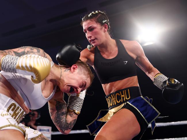 GOLD COAST, AUSTRALIA - DECEMBER 03:  Jasmine Parr punches Nicila Costello during their WIBA Flyweight World Title fight at The Star Gold Coast on December 03, 2022 in Gold Coast, Australia. (Photo by Chris Hyde/Getty Images)