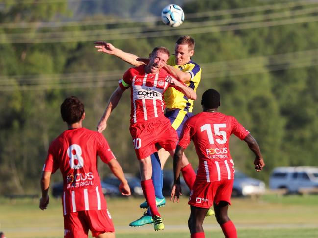 Gold Coast United's Michael Thwaite and Olympic's Alex Smith do battle in the NPL at Coplick Family Sports Park on Sunday. Picture: Craig Clifford