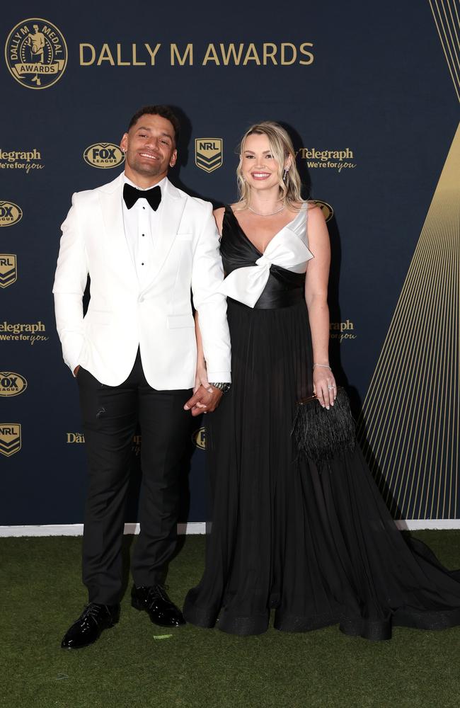 Apisai Koroisau of the Wests Tigers switched things up with a white tuxedo jacket and black bow tie, matching with wife Amy who was also in black and white. (Photo by Mark Kolbe/Getty Images)