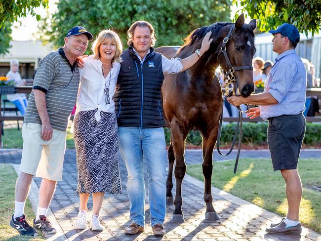 Katie Page with new owners Gerry Harvey and Tom Magnier, who bought Global Glamour for $1.55m at the Magic Millions sales. Picture: Luke Marsden