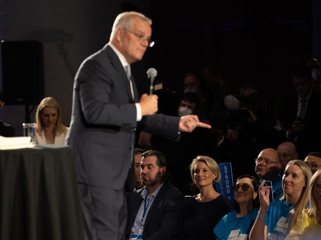 The Prime Minister delivers a speech at Accor stadium in the electorate of Reid, while Katherine Deves watches from the front row. Picture: Jason Edwards