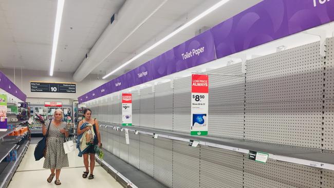 Empty shelves are seen at a Woolworths in Chermside. Picture: John Gass