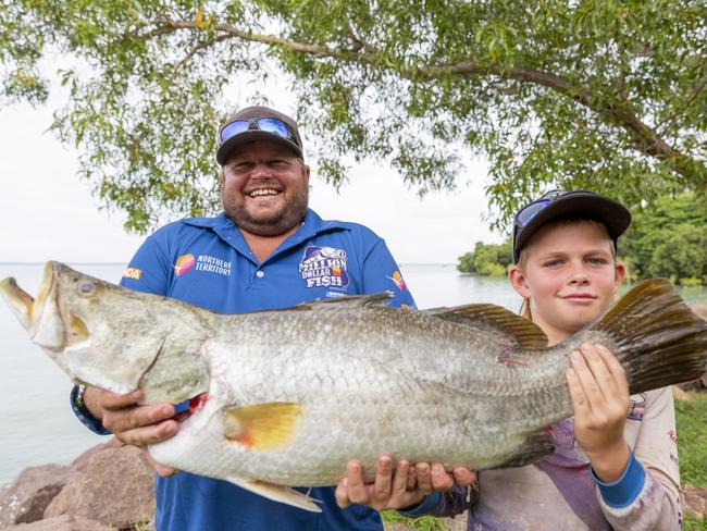 DadJosh and son Jesse James holding their prize $10,000 barra which they caught while fishing on the Adelaide River. Picture: Floss Adams.