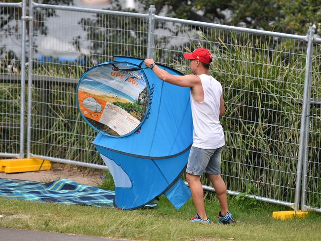 A man is seen setting up his tent at Mrs Macquarie's Point in preparation for New Years Eve Fireworks in Sydney, Monday, December 31, 2018. Picture: AAP / Brendan Esposito