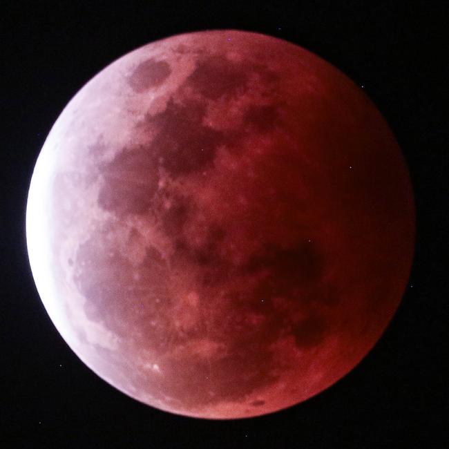 The super blood full moon seen over Darwin on Wednesday night. Pictures: Glenn Campbell