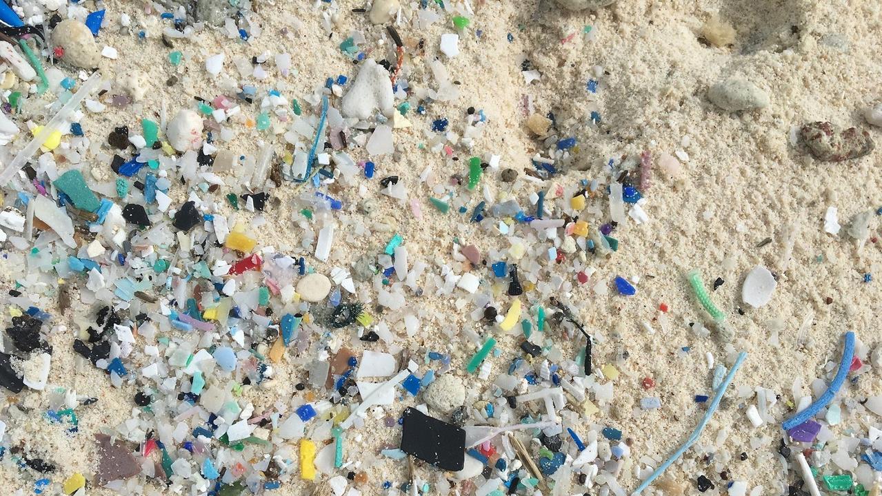 This photo released by the University of Tasmania shows debris on a beach on Cocos Islands.