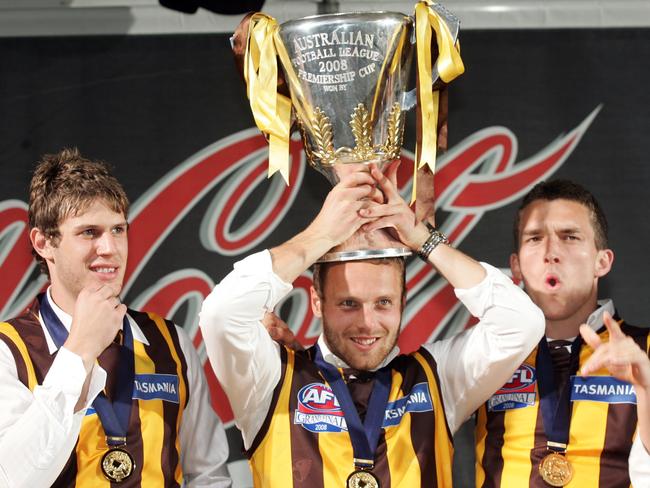 Hawks premiership star Brad Sewell (centre) rented out his Brighton abode after moving to Byron Bay.