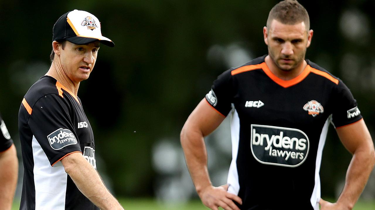 Tigers coach Jason Taylor gives instruction to Robbie Farah and teammates during the Wests Tigers first pre season training session in Leichhardt .Picture Gregg Porteous