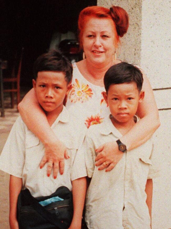 Early days: Cox with Cambodian youngsters.