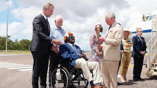 Gumatj Clan Leader Galarrwuy Yunupingu gives Royal Highness Prince Charles a woomera at Gove Airport. Picture: Keri Megelus