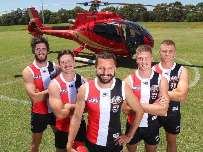 The new St Kilda leadership group after arriving by helicopter at Moorabbin Oval: Dylan Roberton, Jack Steven, captain Jarryn Geary, Jack Newnes and Seb Ross. Picture: Alex Coppel