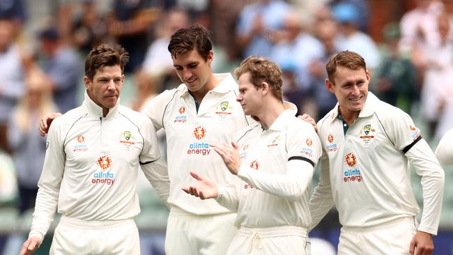 ADELAIDE, AUSTRALIA - DECEMBER 17: Tim Paine of Australia, Pat Cummins of Australia, Steve Smith of Australia and Marnus Labuschagne of Australia after the signing of the national anthem during day one of the First Test match between Australia and India at Adelaide Oval on December 17, 2020 in Adelaide, Australia. (Photo by Cameron Spencer/Getty Images)