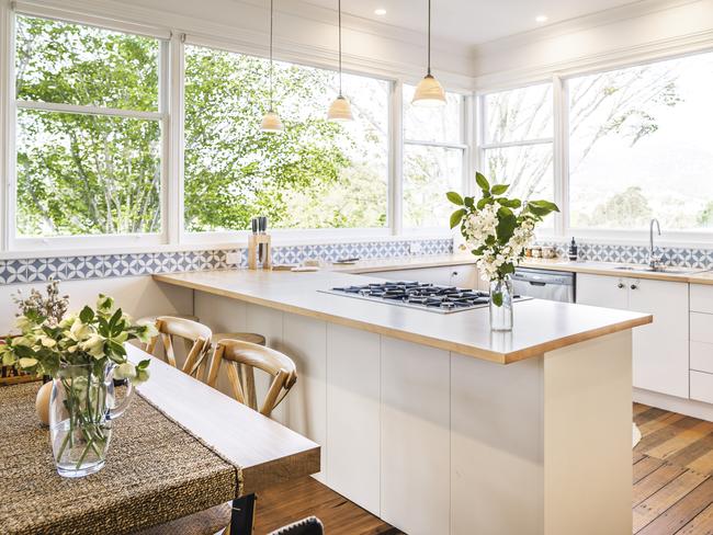 Home Hill Cottage’s sunny open-plan kitchen and dining area. Picture: Joe Chelkowski