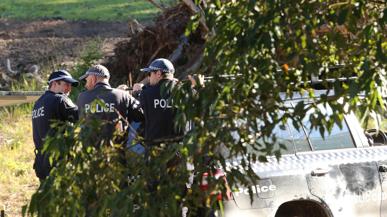 Police pictured outside the old search zone near the house William Tyrell went missing from near Kendall. Picture by Peter Lorimer.