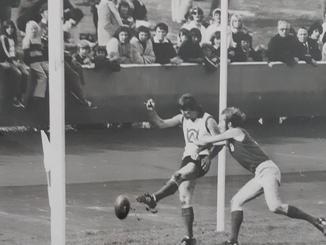 Joe Radojevic knocks over a goal for Geelong West.