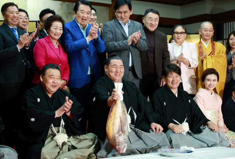 New sumo grand master vows best behaviour after promotion