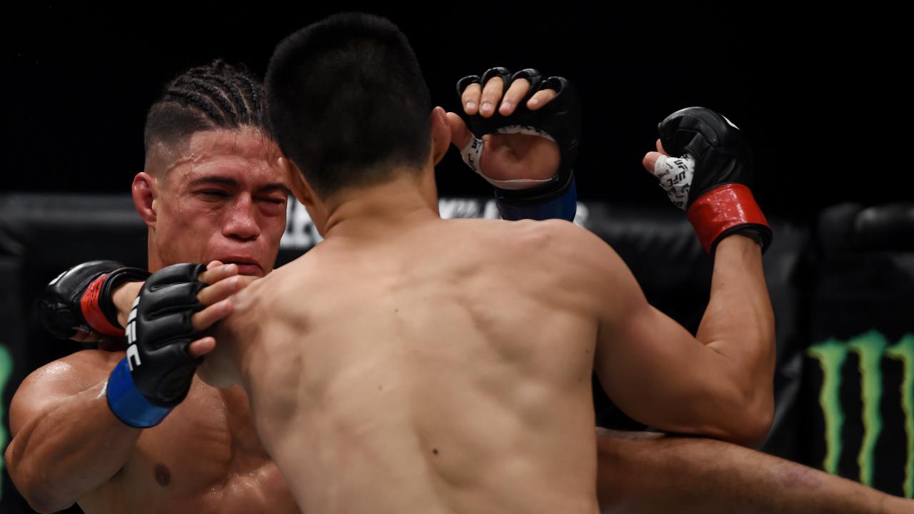 Geane Herrera fights Ben Nguyen of Australia. Photo: AAP Image/Tracey Nearmy.