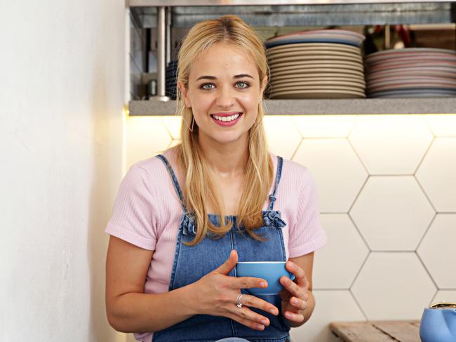 Raechelle enjoying a tea at her favourite Kirribilli cafe Oski. Picture: Adam Yip