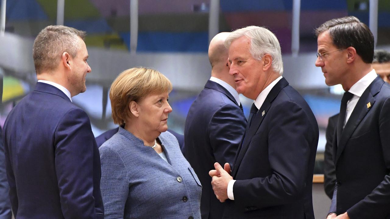 German Chancellor Angela Merkel, centre left, speaks with European Union chief Brexit negotiator Michel Barnier, centre right, and Slovakian Prime Minister Peter Pellegrini, left, during a round table meeting at an EU summit in Brussels. Picture: AP/Geert Vanden Wijngaert