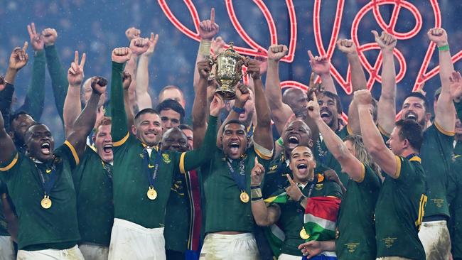 PARIS, FRANCE - OCTOBER 28: Damian Willemse of South Africa lifts the The Webb Ellis Cup following the Rugby World Cup Final match between New Zealand and South Africa at Stade de France on October 28, 2023 in Paris, France. (Photo by Dan Mullan/Getty Images)