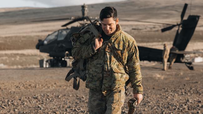 A Darwin-based Australian Army pilot training on the Apache helicopter (background). Picture: Supplied.