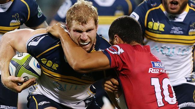 CANBERRA, AUSTRALIA - FEBRUARY 13: David Pocock of the Brumbies is tackled during the round one Super Rugby match between the Brumbies and the Reds at GIO Stadium on February 13, 2015 in Canberra, Australia. (Photo by Stefan Postles/Getty Images)