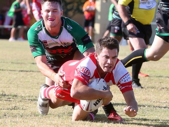 Scott Bunt scoring one of his many tries for Currumbin. Picture by Richard Gosling.