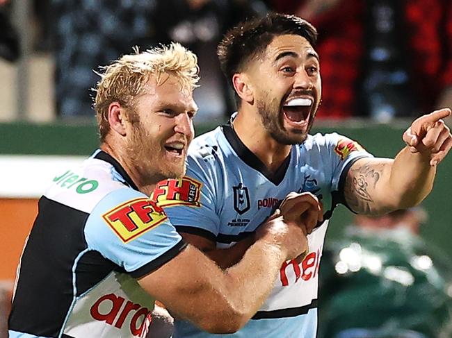 SYDNEY, AUSTRALIA - JUNE 11:  Shaun Johnson of the Sharks celebrates with his team mates after scoring a try during the round 14 NRL match between the Cronulla Sharks and the Penrith Panthers at Netstrata Jubilee Stadium, on June 11, 2021, in Sydney, Australia. (Photo by Mark Kolbe/Getty Images)