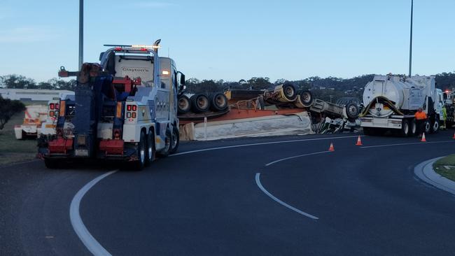 A truck has rolled on the Dawson Highway at Clinton.