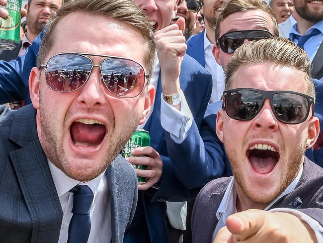 Melbourne Cup. 2016. Flemington. Punters celebrate a win in race 3. Picture: Jake Nowakowski