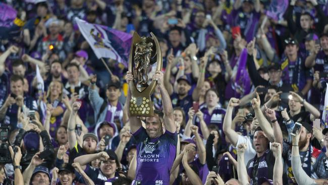 Storm Cameron Smith holds the trophy aloft after the NRL grand final.