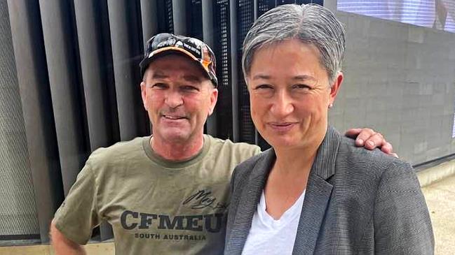 CFMEU ‘enforcer’ Scott Vink poses with Foreign Minister Penny Wong at the Adelaide May Day rally this year.