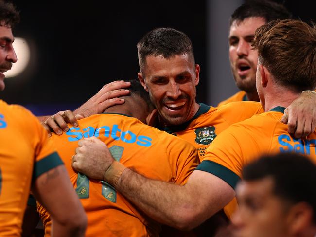 SYDNEY, AUSTRALIA - JULY 06: Filipo Daugunu of the Wallabies celebrates with team mates after scoring a try during the men's International Test match between Australia Wallabies and Wales at Allianz Stadium on July 06, 2024 in Sydney, Australia. (Photo by Jason McCawley/Getty Images)