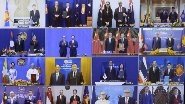 Scott Morrison and then trade minister Simon Birmingham, second from top left, attend the virtual signing of a Regional Comprehensive Economic Partnership trade deal in Parliament House. Picture: NCA NewsWire /Gary Ramage