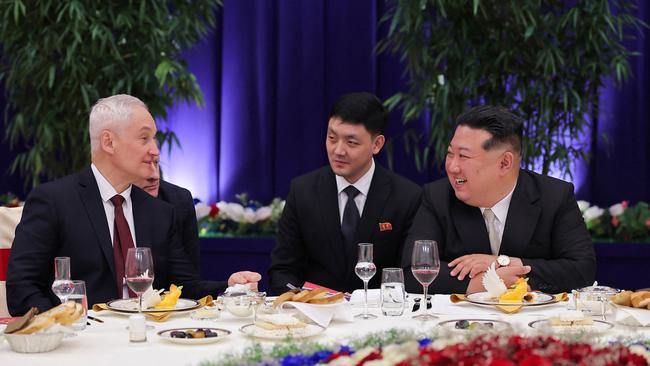 North Korean dictator Kim Jong-un, right, chats with Russian Defence Minister Andrei Belousov, left, at a banquet in Pyongyang.