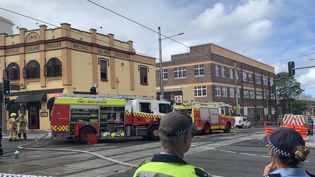 Fire crews outside the restaurant (left) on July 4. Picture: Anton Rose