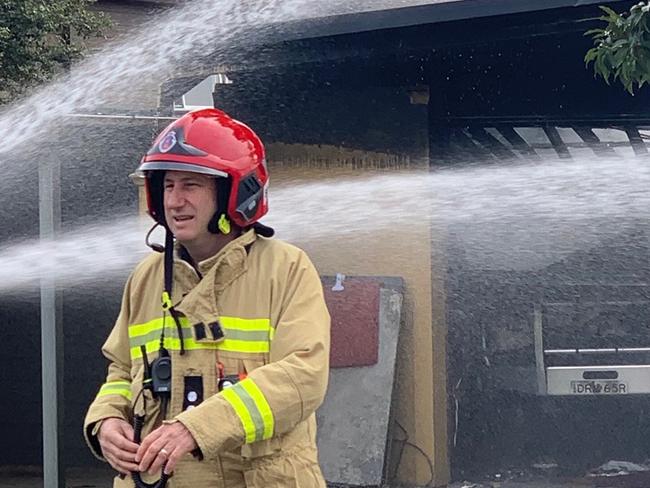 Firefighters fight to contain a garage fire in Seaforth. Picture: Max Angency