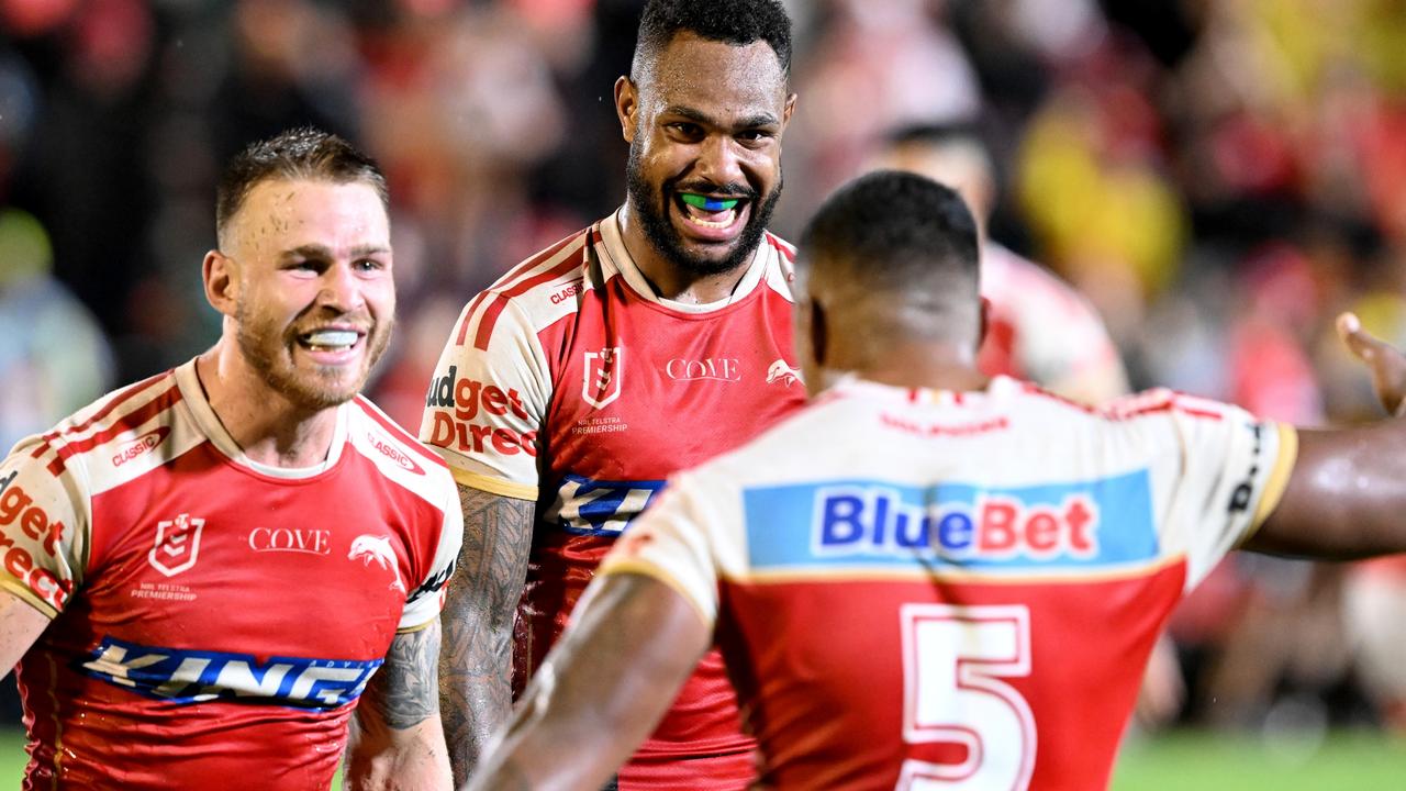 Hamiso Tabuai-Fidow, Euan Aitken and Tesi Niu celebrate victory after the Dolphins beat the Canberra Raiders.