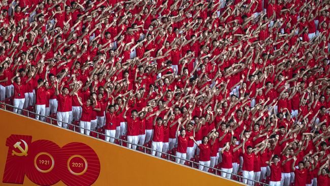 The audience waves during a mass gala marking the 100th anniversary of the Chinese Communist Party at Beijing’s Bird's Nest stadium on Monday. Picture: Getty Images