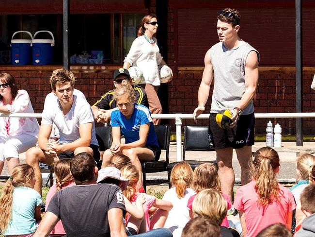 Jack and Jess Trengove and Lachie Neale speaking to juniors at Kybybolite.