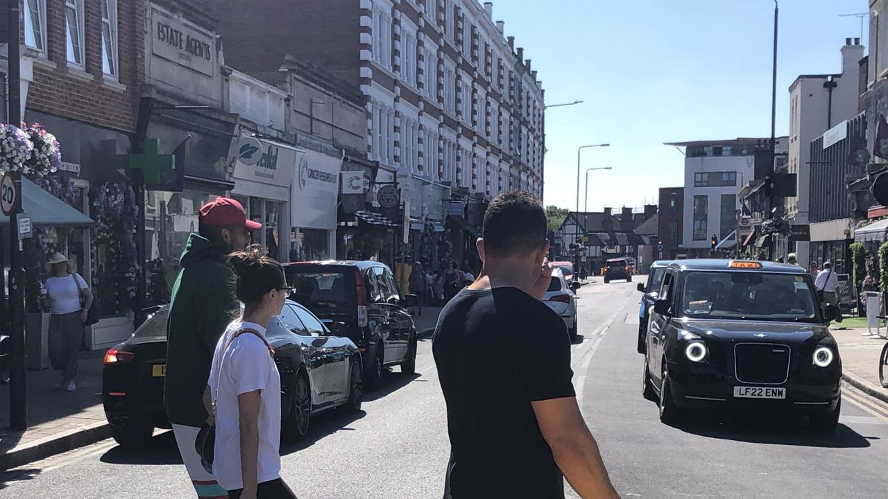 Nick Kyrgios and girlfriend Costeen Hatzi enjoy a stroll around the streets of Wimbledon before settling on a quaint cafe.