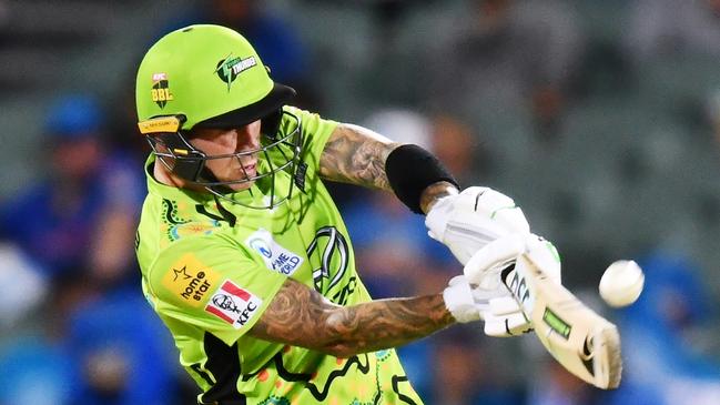 Sydney Thunder’s Alex Hales pounds a six against the Strikers at Adelaide Oval