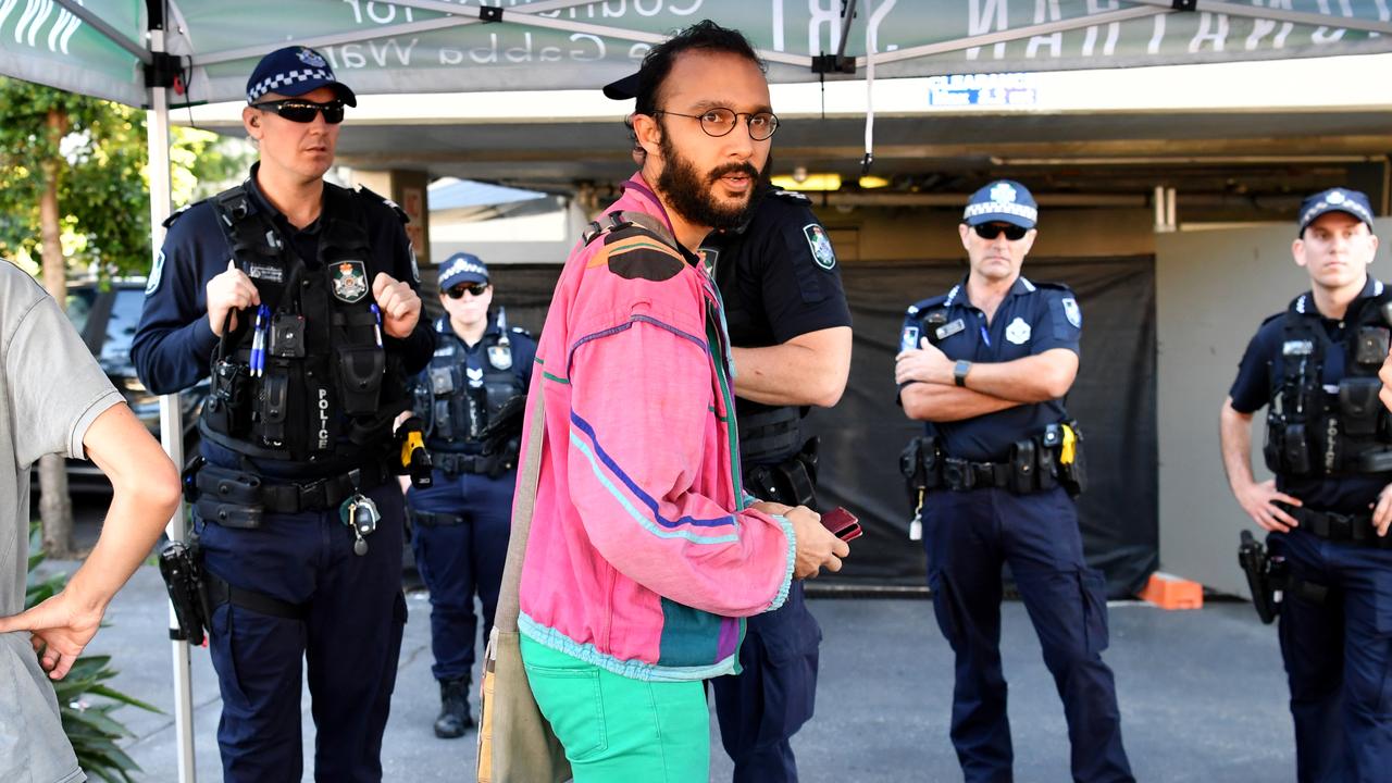 Cr Jonathan Sri (centre) with police outside the Kangaroo Point Central Hotel in Brisbane in June 2020 where protestors staged a blockade to support asylum seekers. Picture: AAP/Darren England)