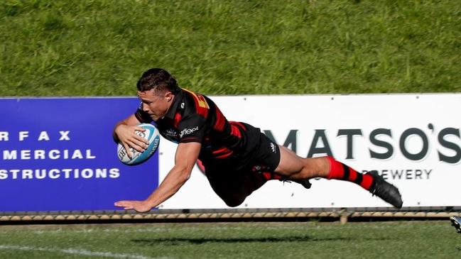 Northern Suburbs rugby player Nick Duffy in full flight.