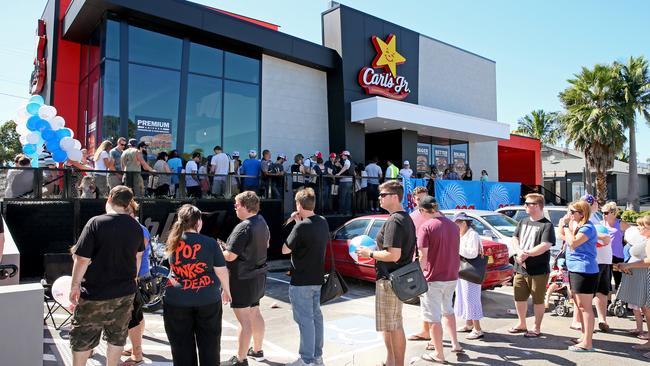 Customers queue outside Australia’s first Carl's Jnr outlet at Bateau Bay. Picture: Troy Snook