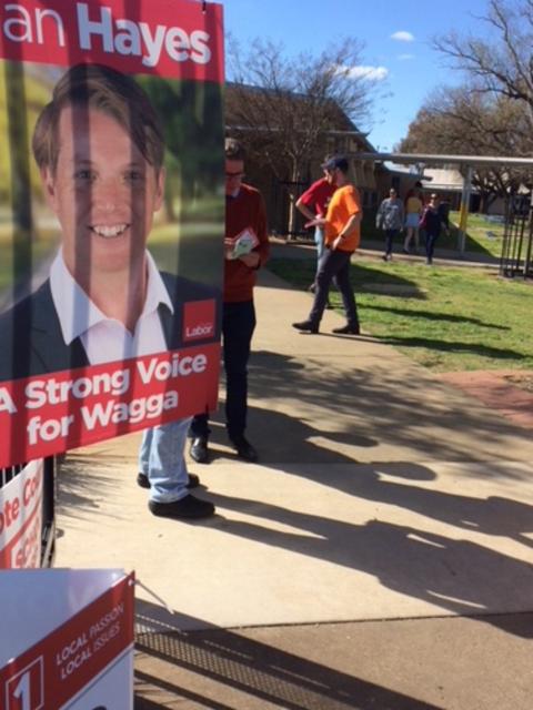 Labor supporters wearing orange.