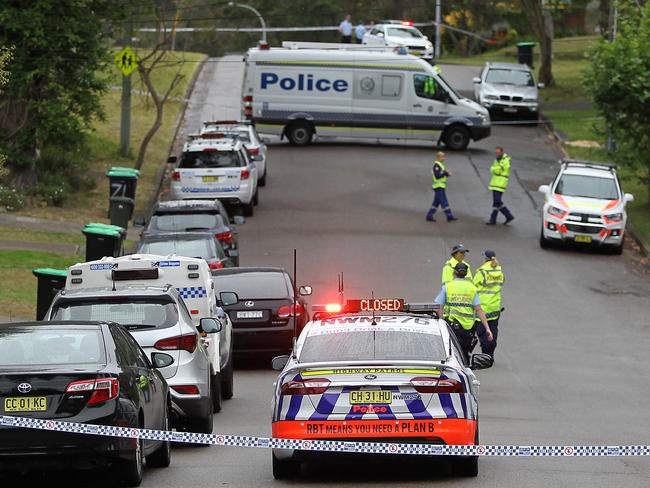 Police cordon off the scene in Sir Thomas Mitchell Drive, Davidson, today. Picture: Martin Lange.