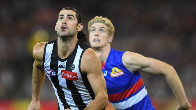 Magpies Brodie Grundy  and Bulldogs Tim English contest in the round 4 match at the MCG. Picture: Julian Smith/AAP