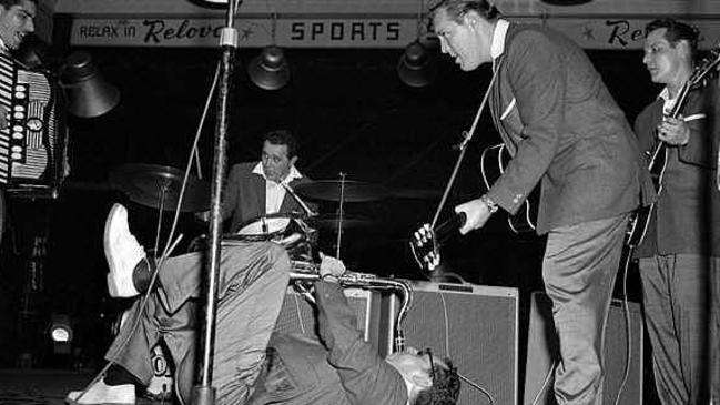 9 January 1957 - Rolling or rocking it all added up to arobatic interpretations when Bill Haley (2nd right) sent his Comets into action at Brisbane's Stadium (Pic Bob Millar jnr K9843-52 neg missing pub 10/1/57)